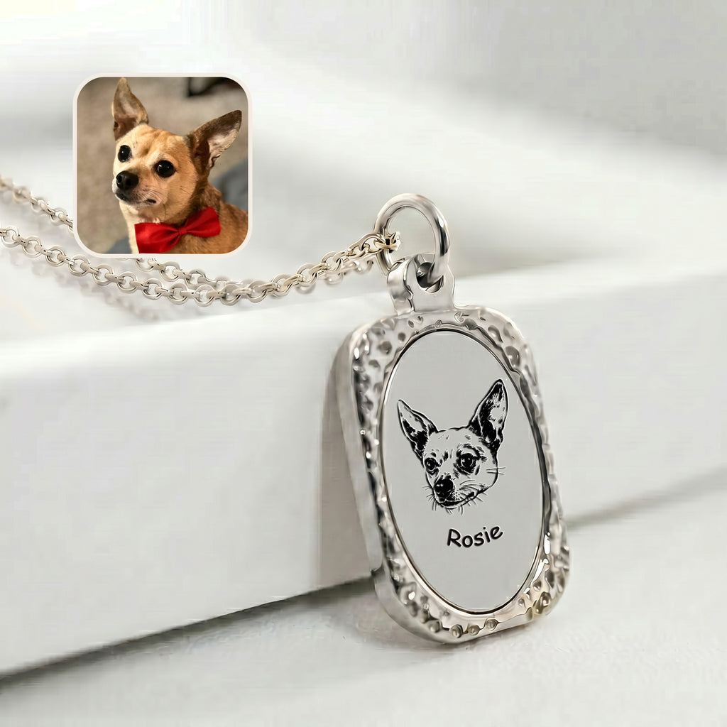 Rhodium pet memorial tag necklace with hand-drawn portrait, lifestyle detail on surface