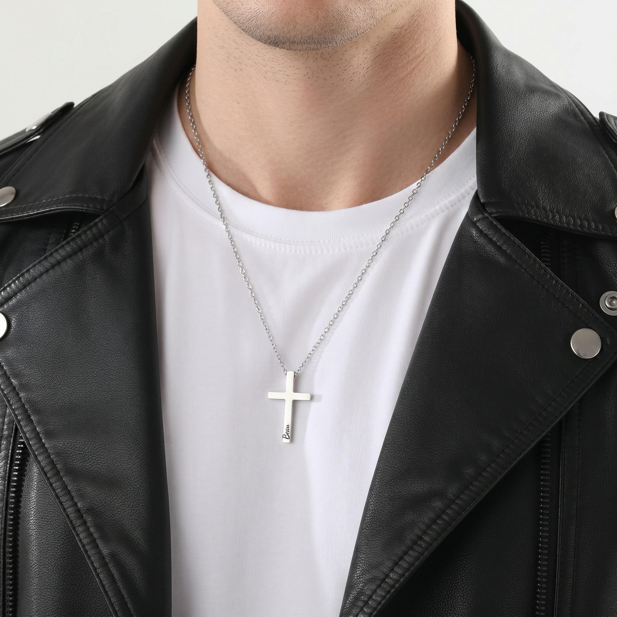 Man wearing rhodium silver cross necklace with engraved pet name