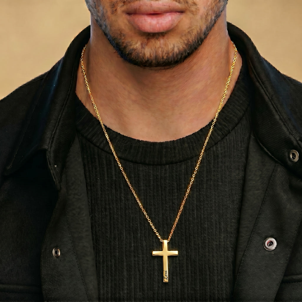 Man wearing 18K gold personalized cross necklace, casual dark outfit