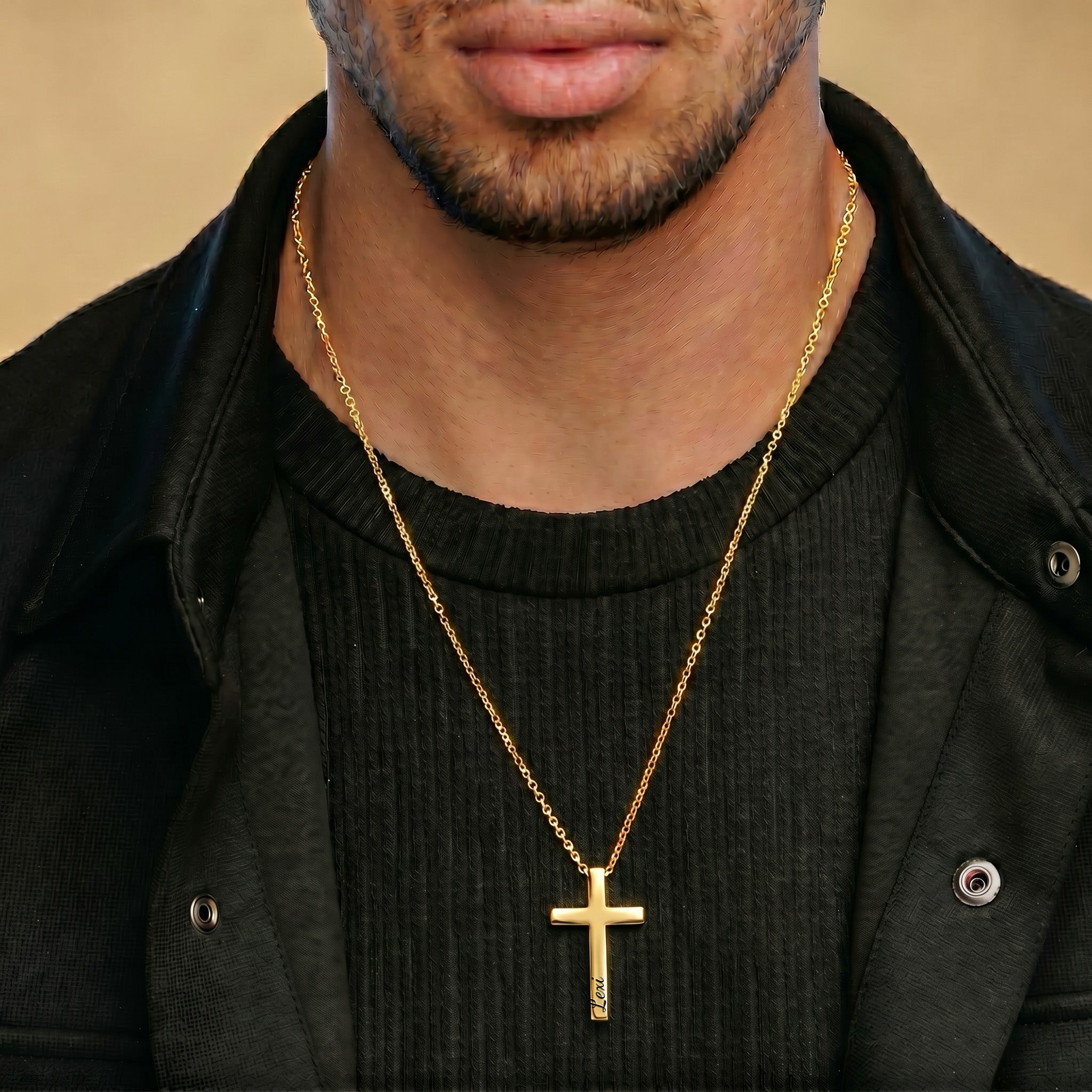Man wearing 18K gold personalized cross necklace, casual dark outfit