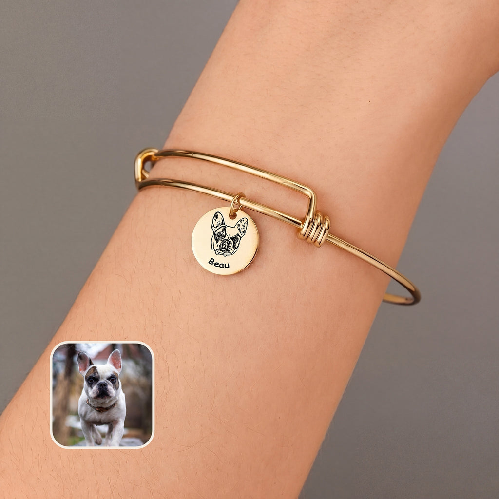 18K gold wire bangle bracelet with one engraved pet portrait disc charm, worn on the wrist