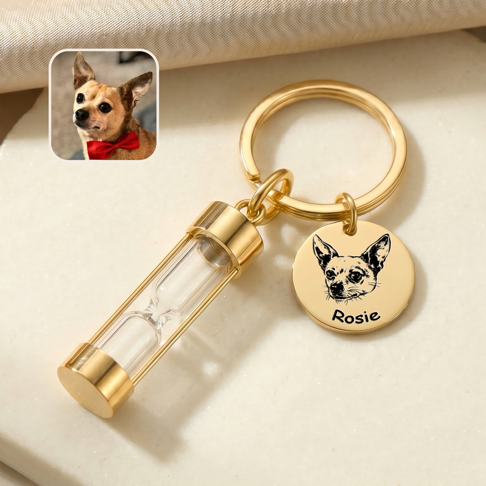 18k gold-plated pet portrait hourglass keychain on marble surface with engraved chihuahua portrait disc and glass hourglass urn, with reference photo inset