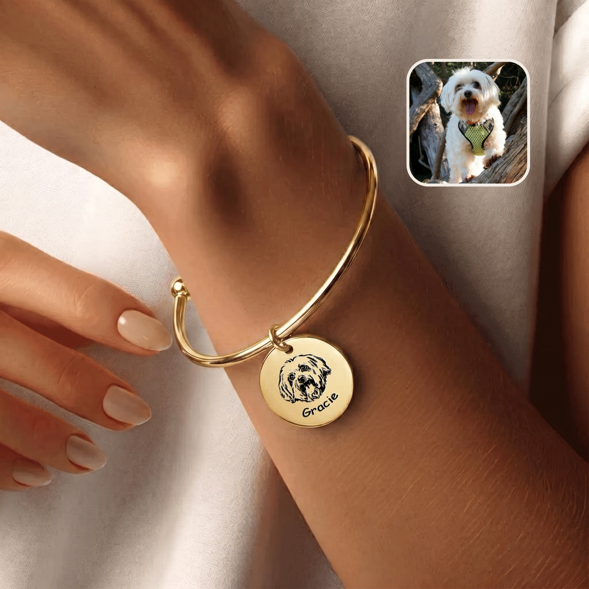 18K gold-plated pet photo cuff bracelet with hand-drawn portrait disc charm, worn on a wrist beside an inset dog photo