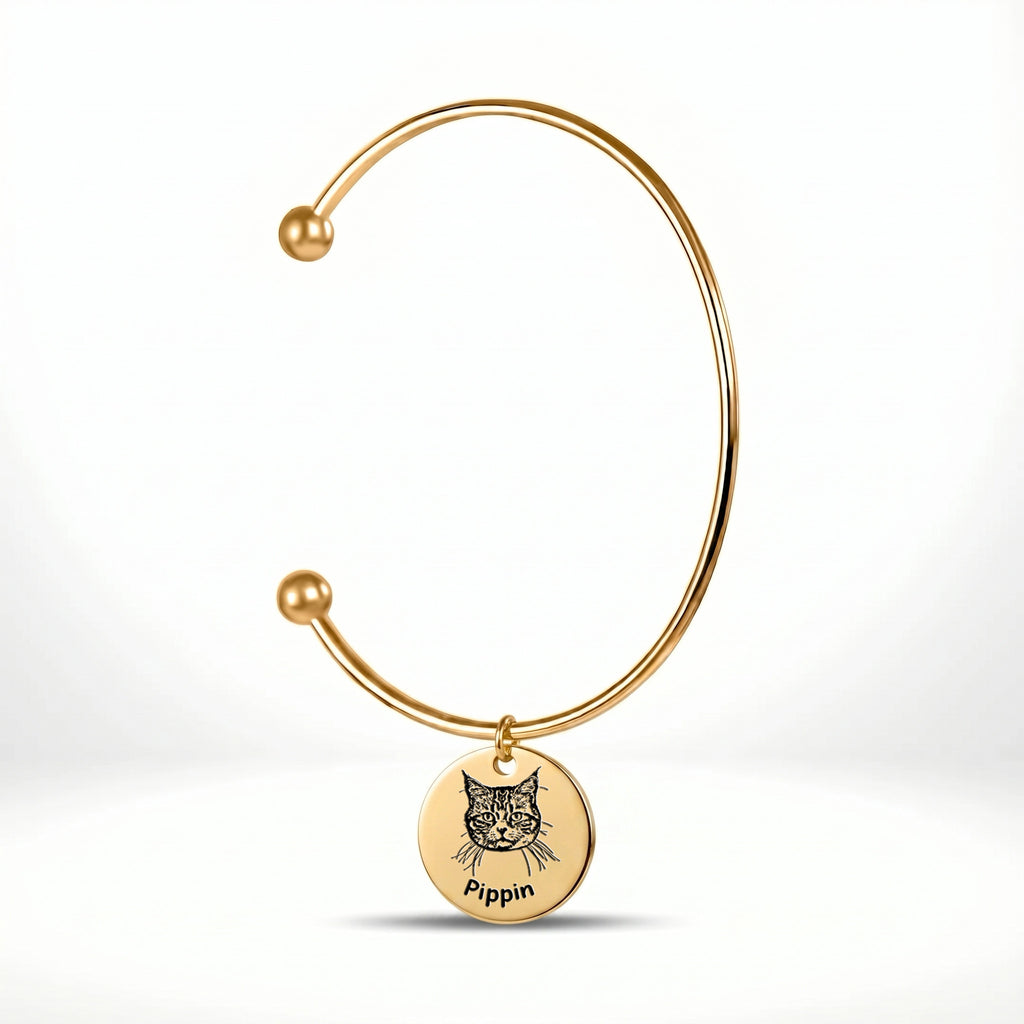 18K gold-plated open cuff bracelet with engraved pet portrait disc charm on a white background