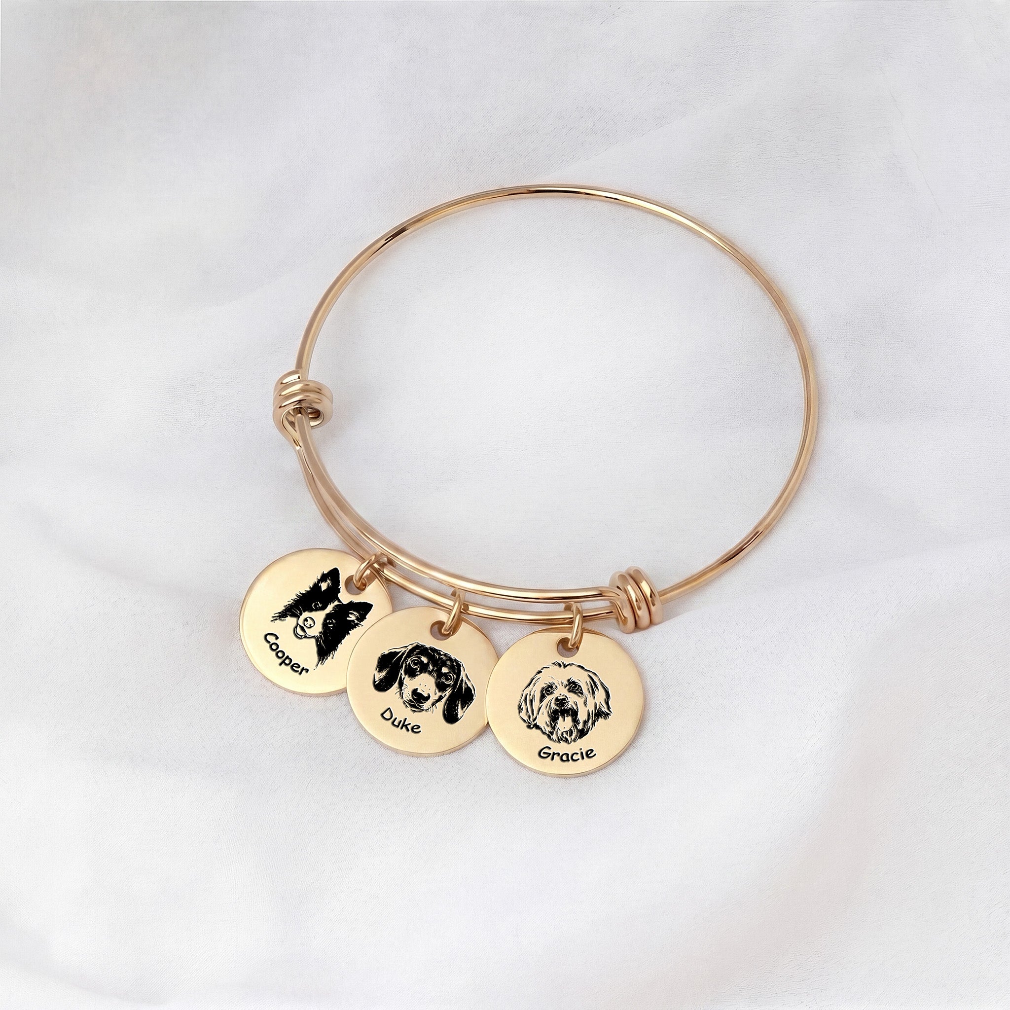 18K gold pet photo bracelet with three engraved disc charms, one portrait per pet