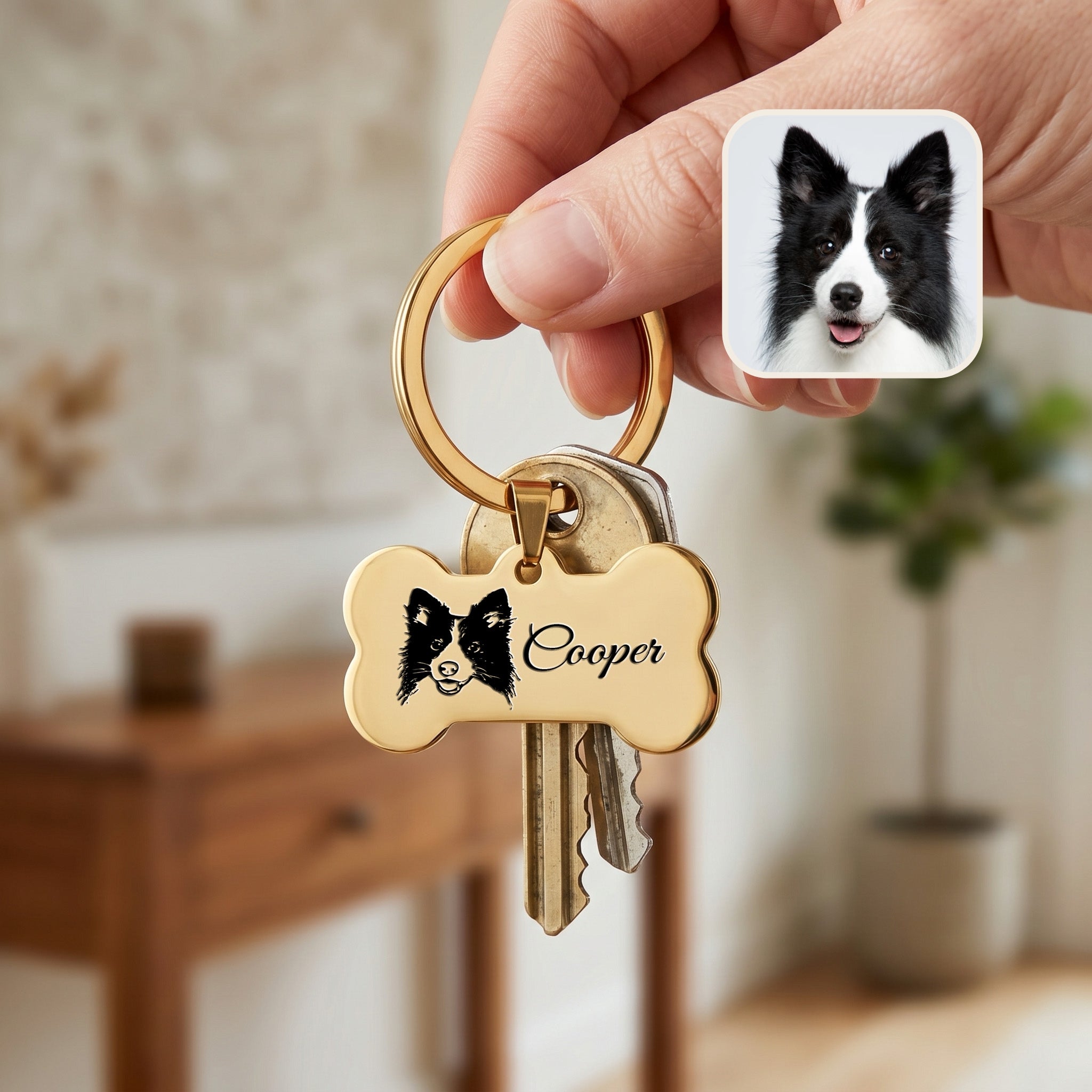 18k yellow gold pet bone keychain held in hand with keys — showing scale of the bone pendant for daily carry