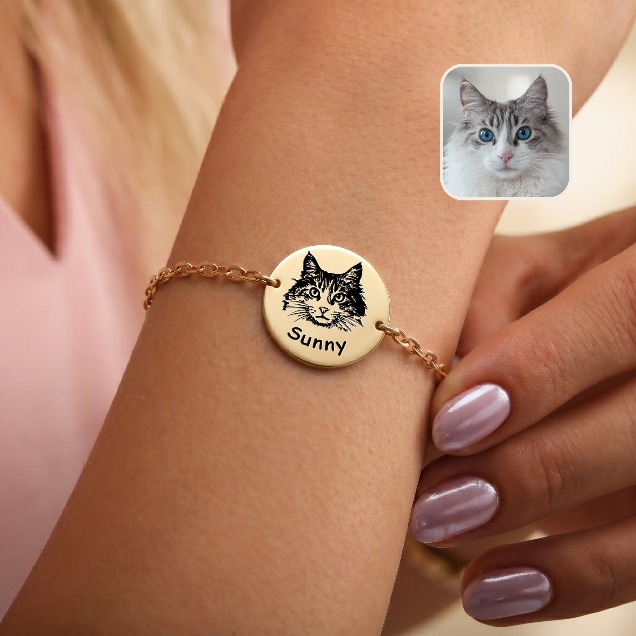 Gold-plated pet portrait chain bracelet on a wrist, hand-drawn cat portrait and name on disc charm, with inset grey cat photo