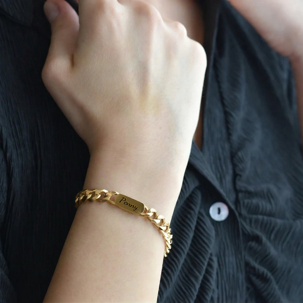 18K gold personalized pet name bracelet engraved in script, worn on the wrist